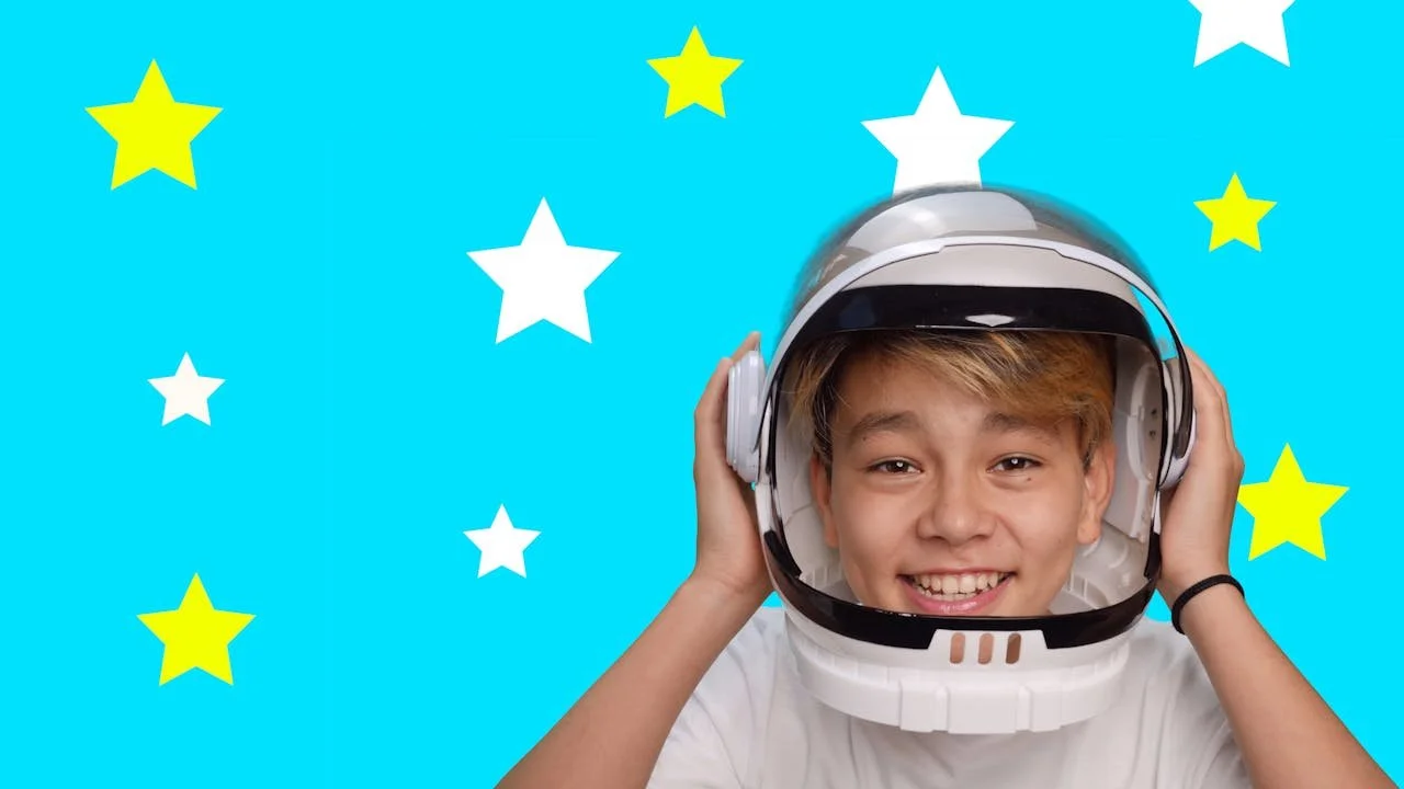 A boy wearing a space helmet
