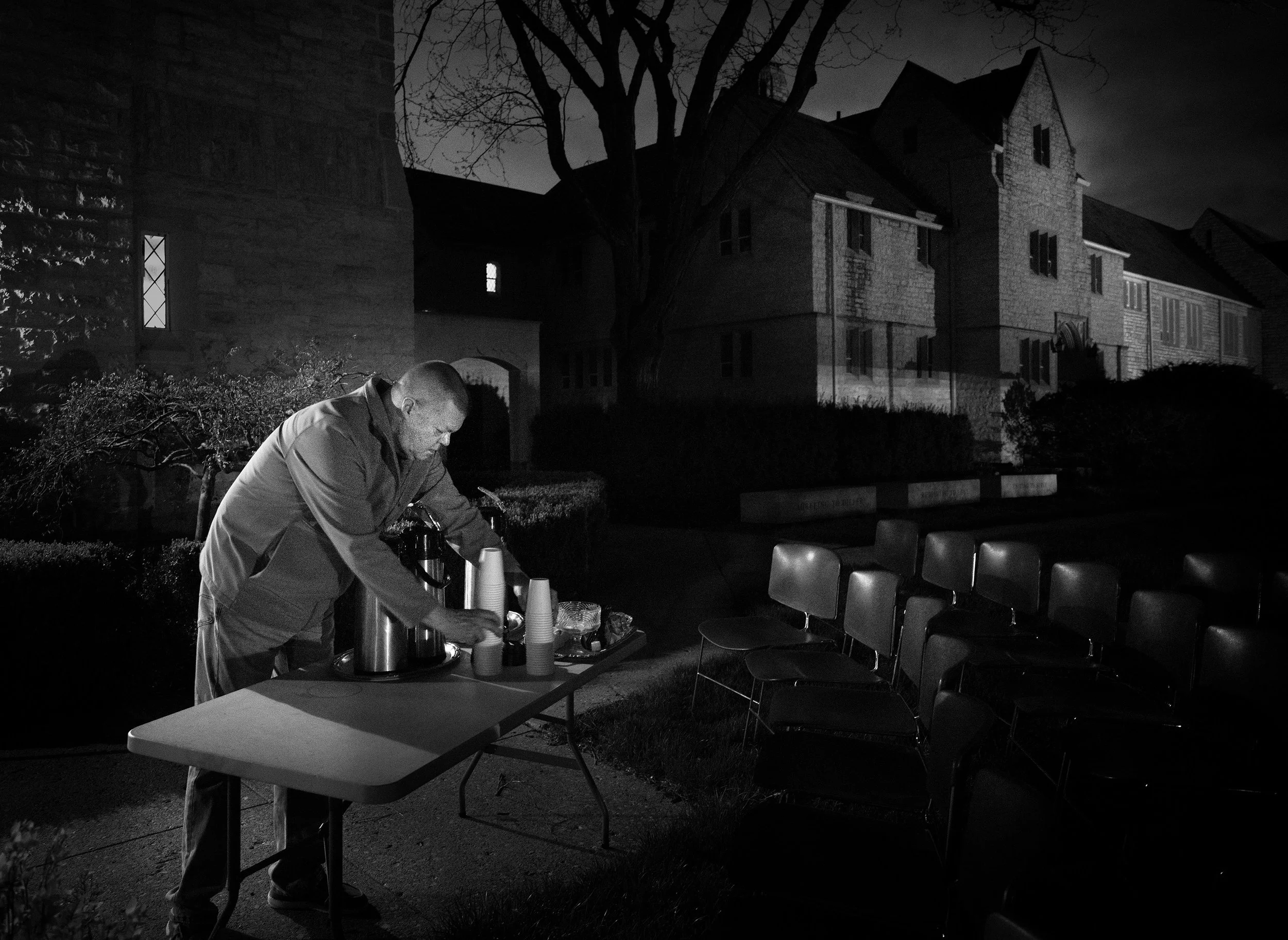 Paul Jansons, a member of the Facilities Staff, prepares hot coffee ahead of the service.