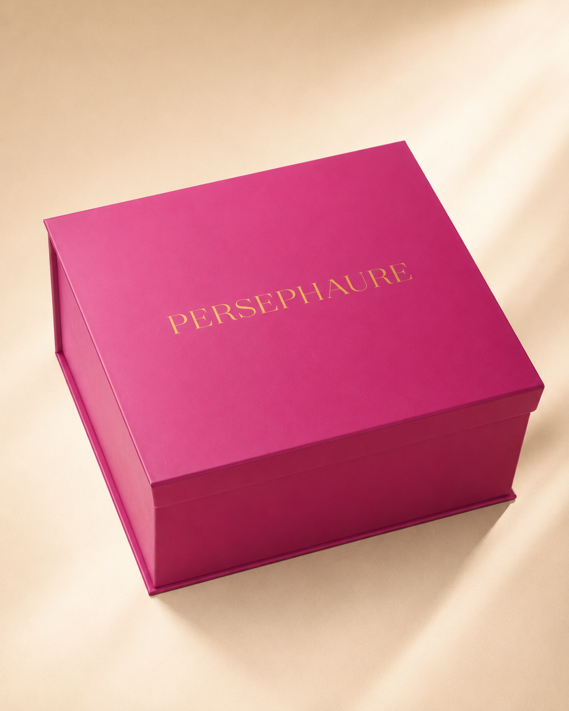 Closed pink Persephaure presentation box for The Lady set of two wine glasses.