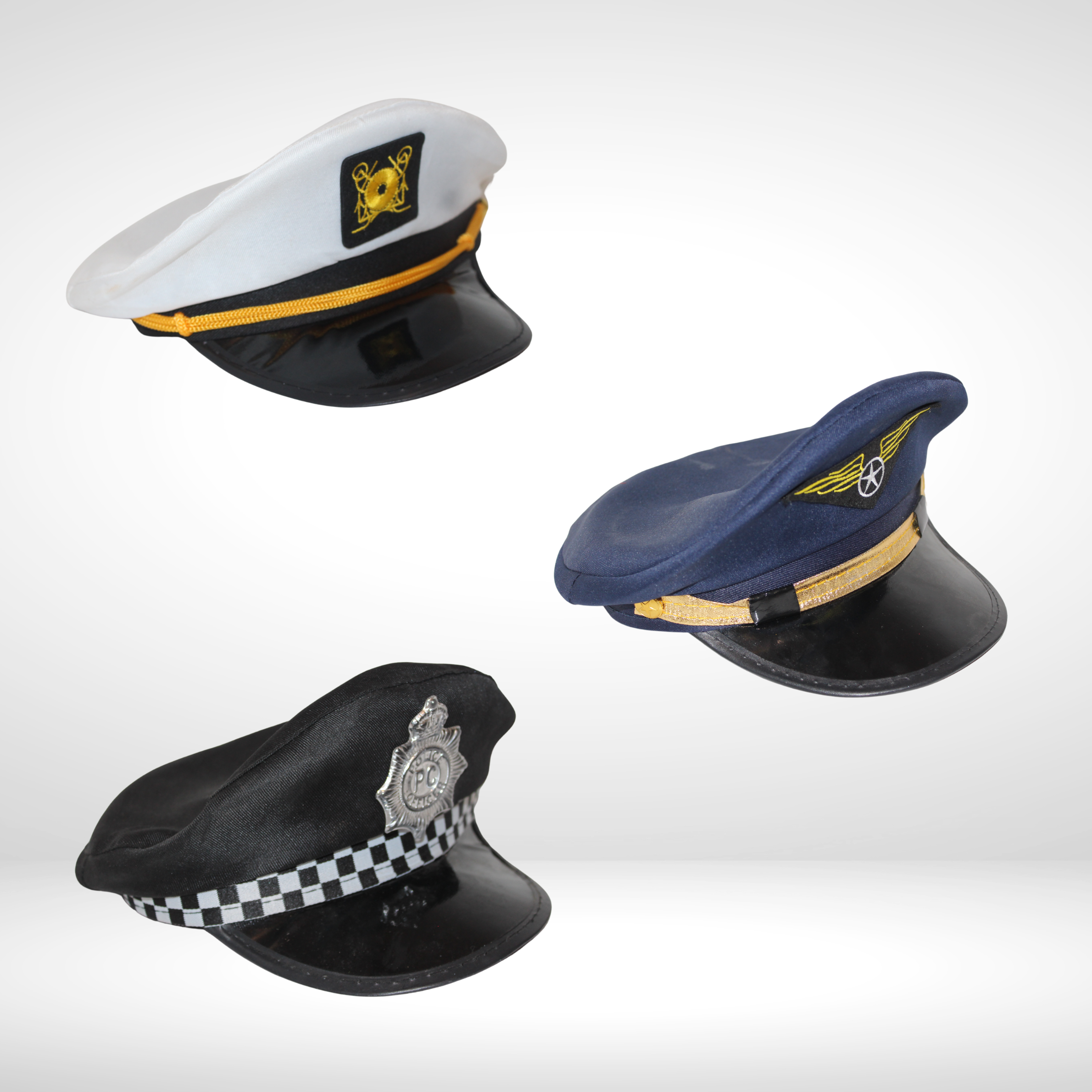 Three toy police officer hats, each with a different design, floating against a white background.