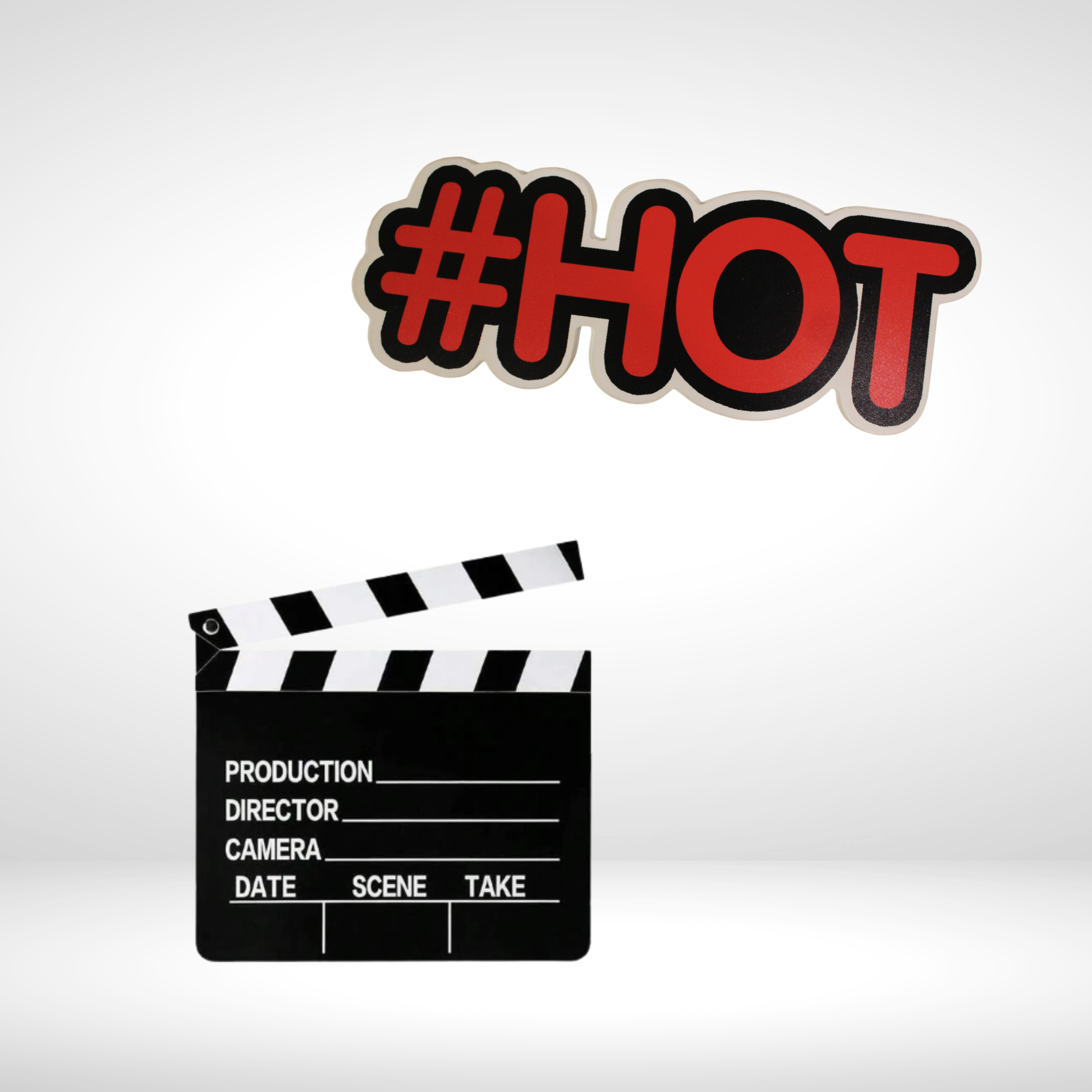 A film clapperboard with a black and white striped top and labeled sections, and a red and black sticker that reads '#HOT'.