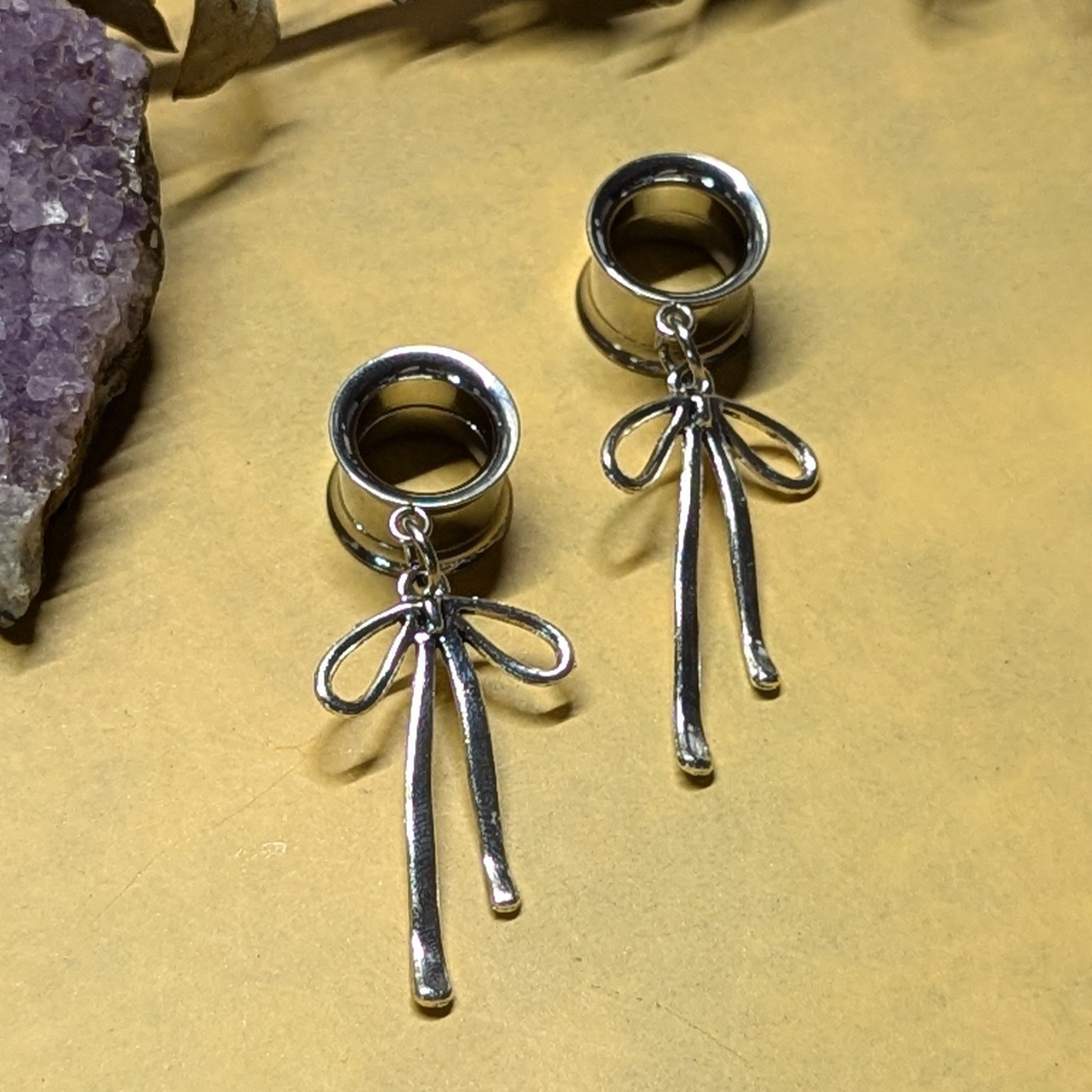 Silver bow dangle gauges