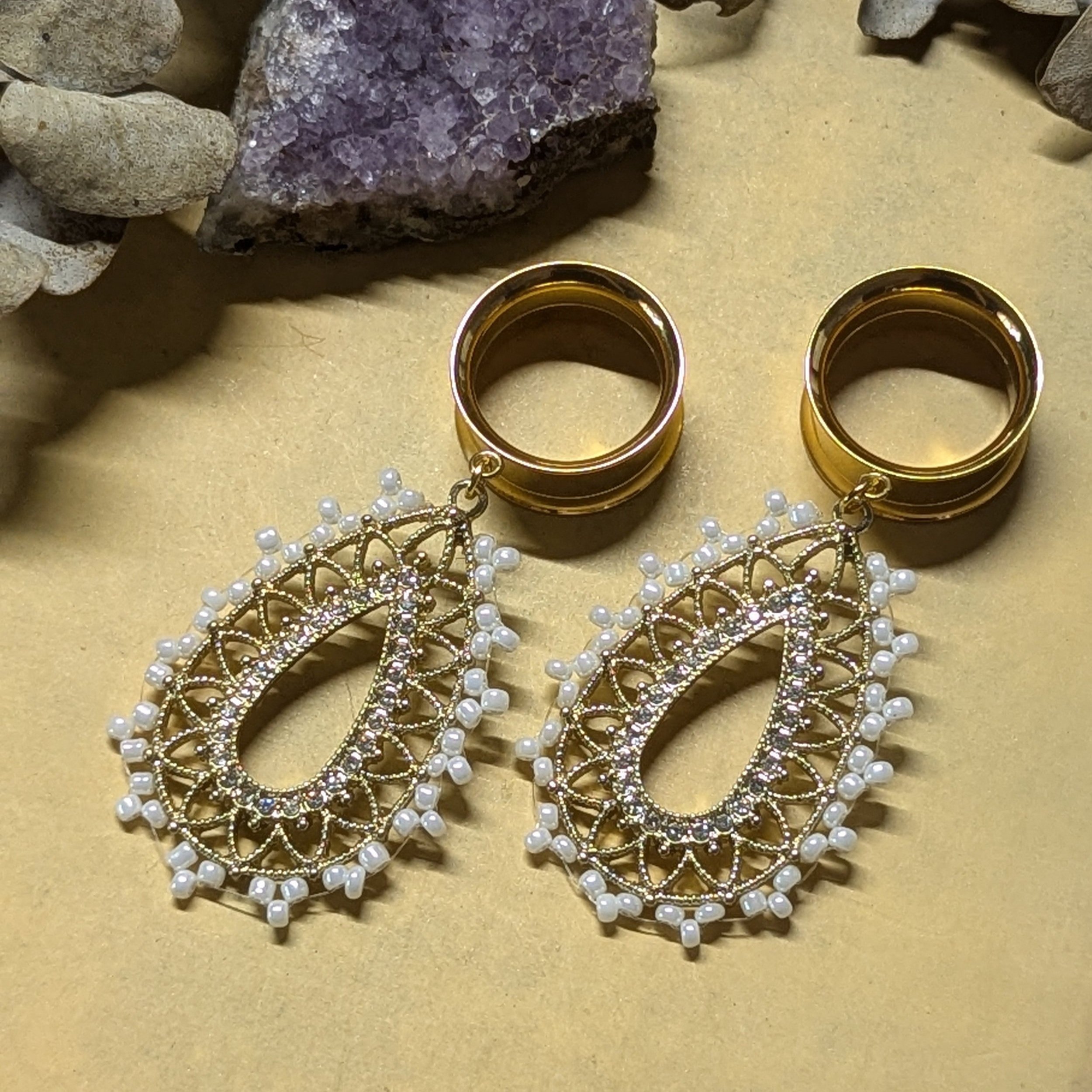 Beaded dangle gauges