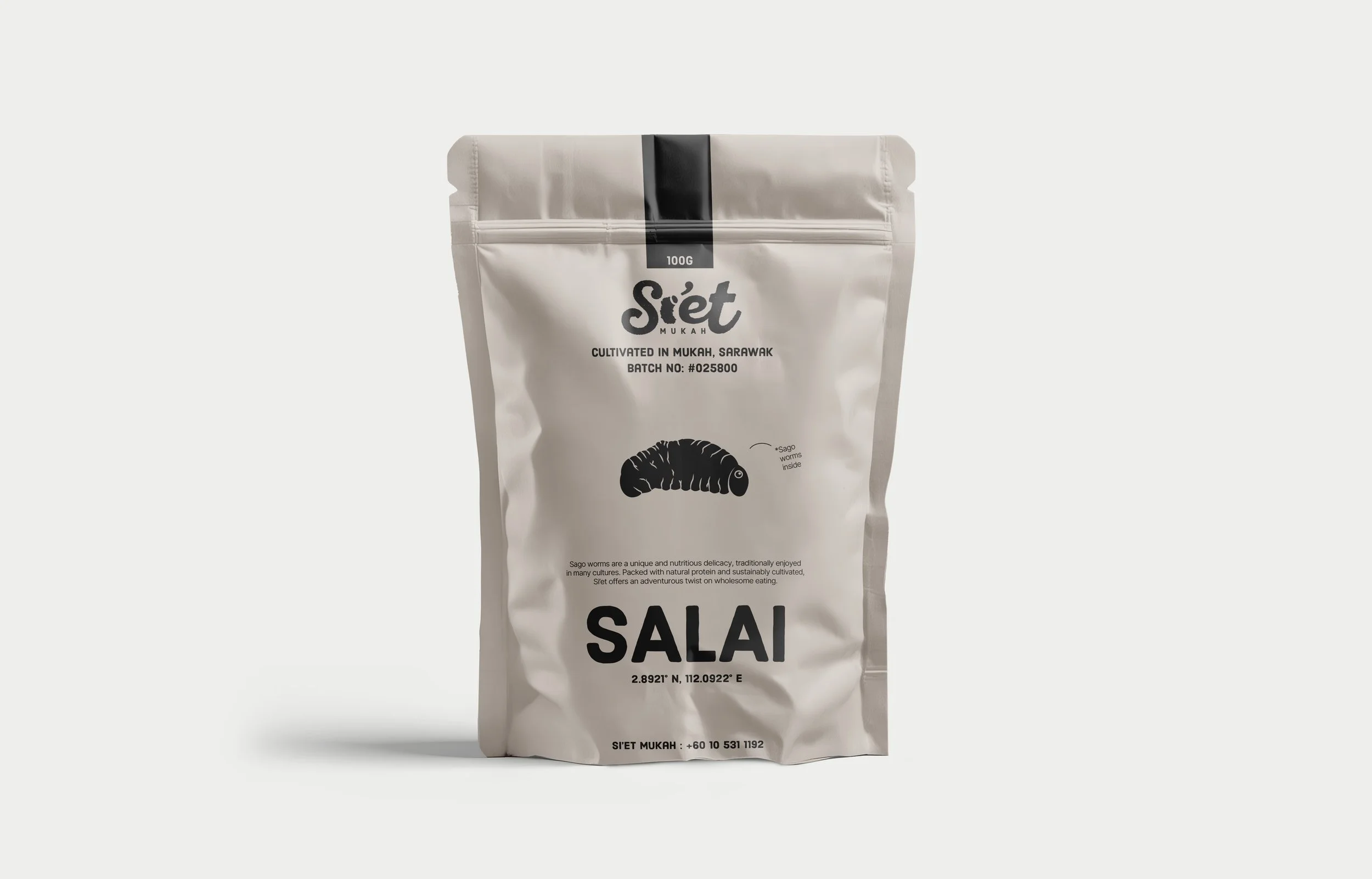A white stand-up pouch with black text and illustrations featuring Sago worms, a traditional delicacy from Sarawak, Malaysia.