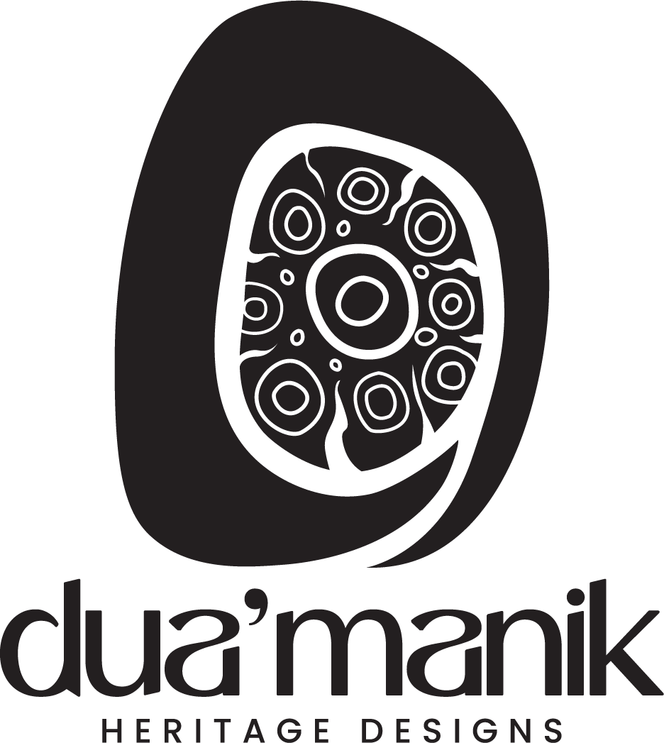 Simplified drawing of a tree ring cross section with the word 'Dua'manik' and 'Heritage Designs' below it.