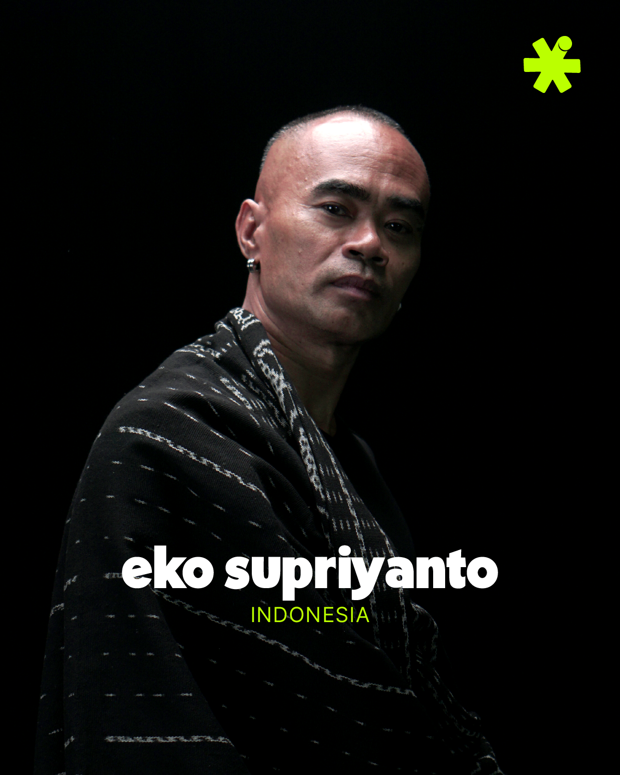 Portrait of a man with short hair, wearing a black and white patterned jacket, against a black background. Text overlay reads 'eko supriyanto' and 'INDONESIA'.