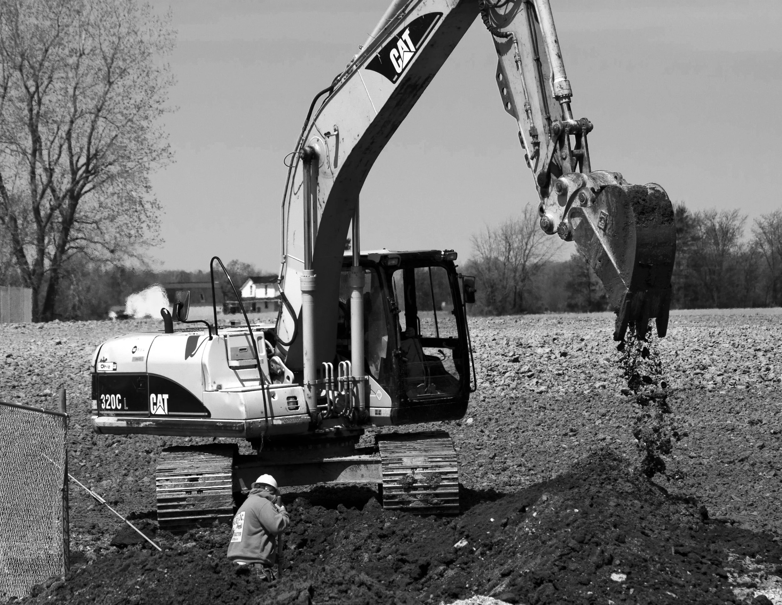 Black and white photo taken during construction of the Shelby Senior High School, for the SDG Newsgroup's "Daily Globe" publication. Taking inspiration from Arthur Felig's work, the photo focuses on a human element and emphasizes strong contrast in b