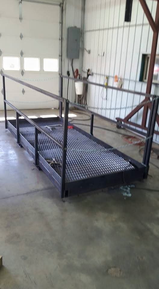 Metal platform with railings in a workshop