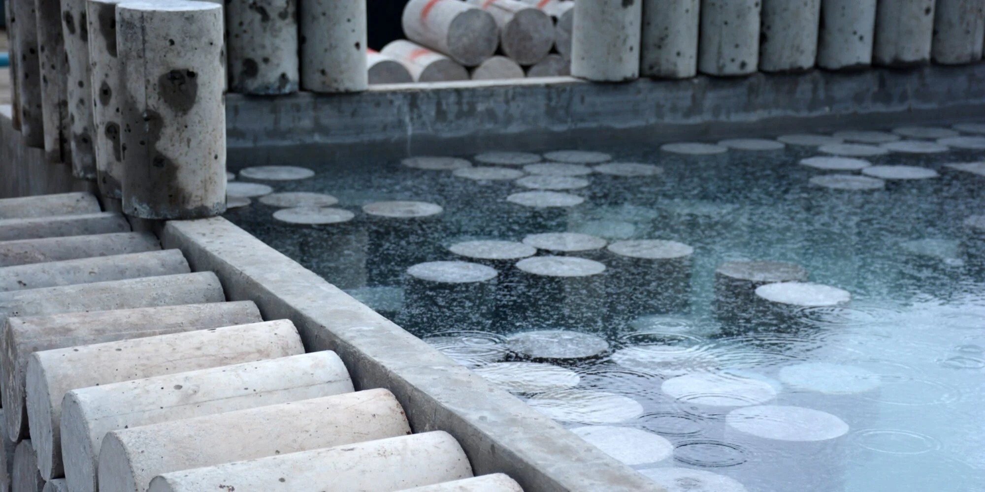 Core samples in lab water curing tank