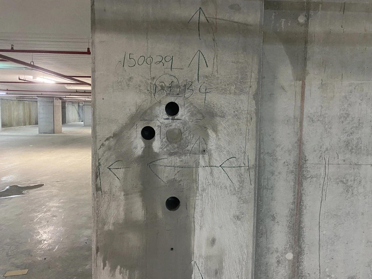Concrete column with core extraction holes