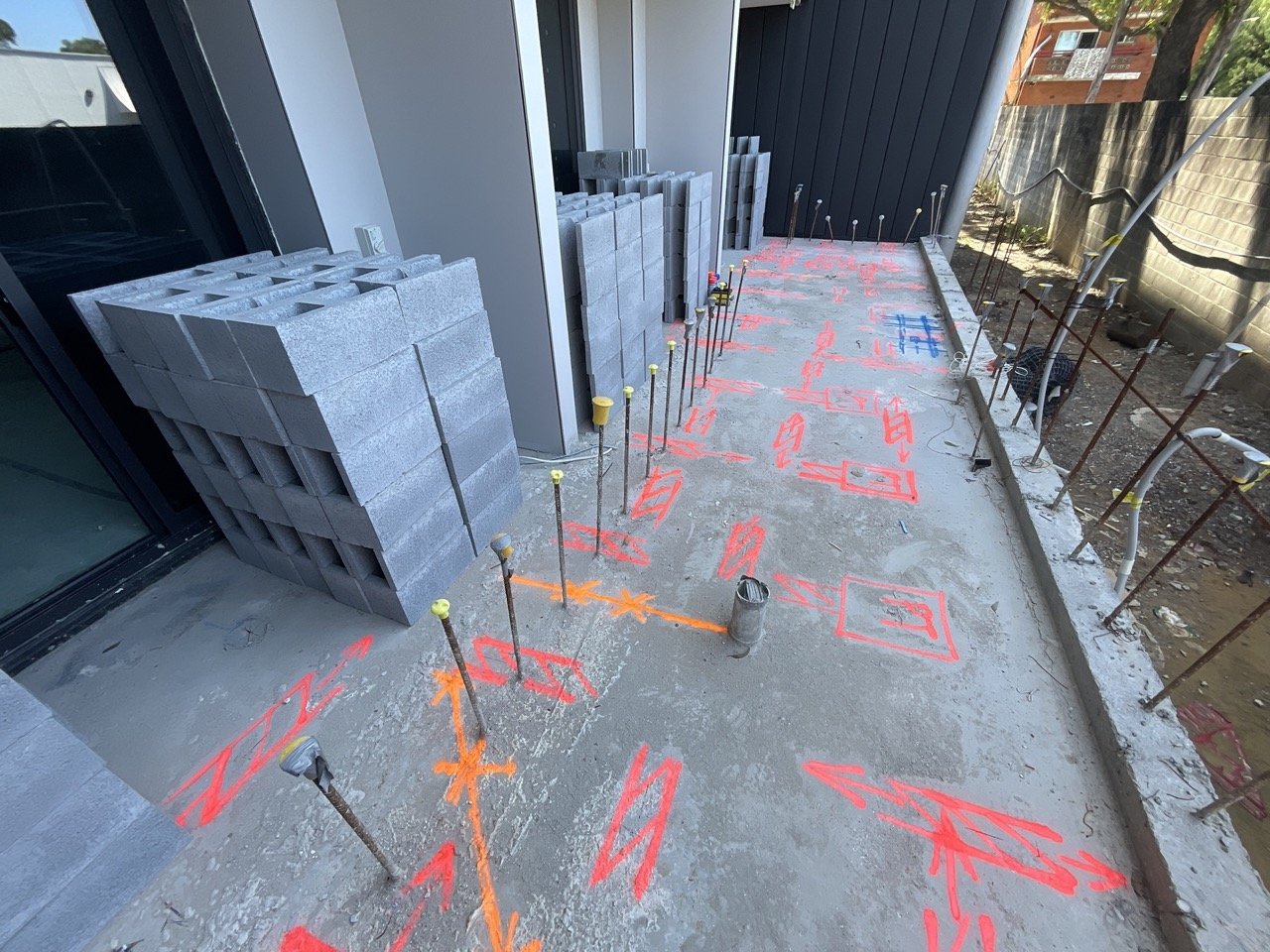 Spray-paint PT and rebar markings on slab