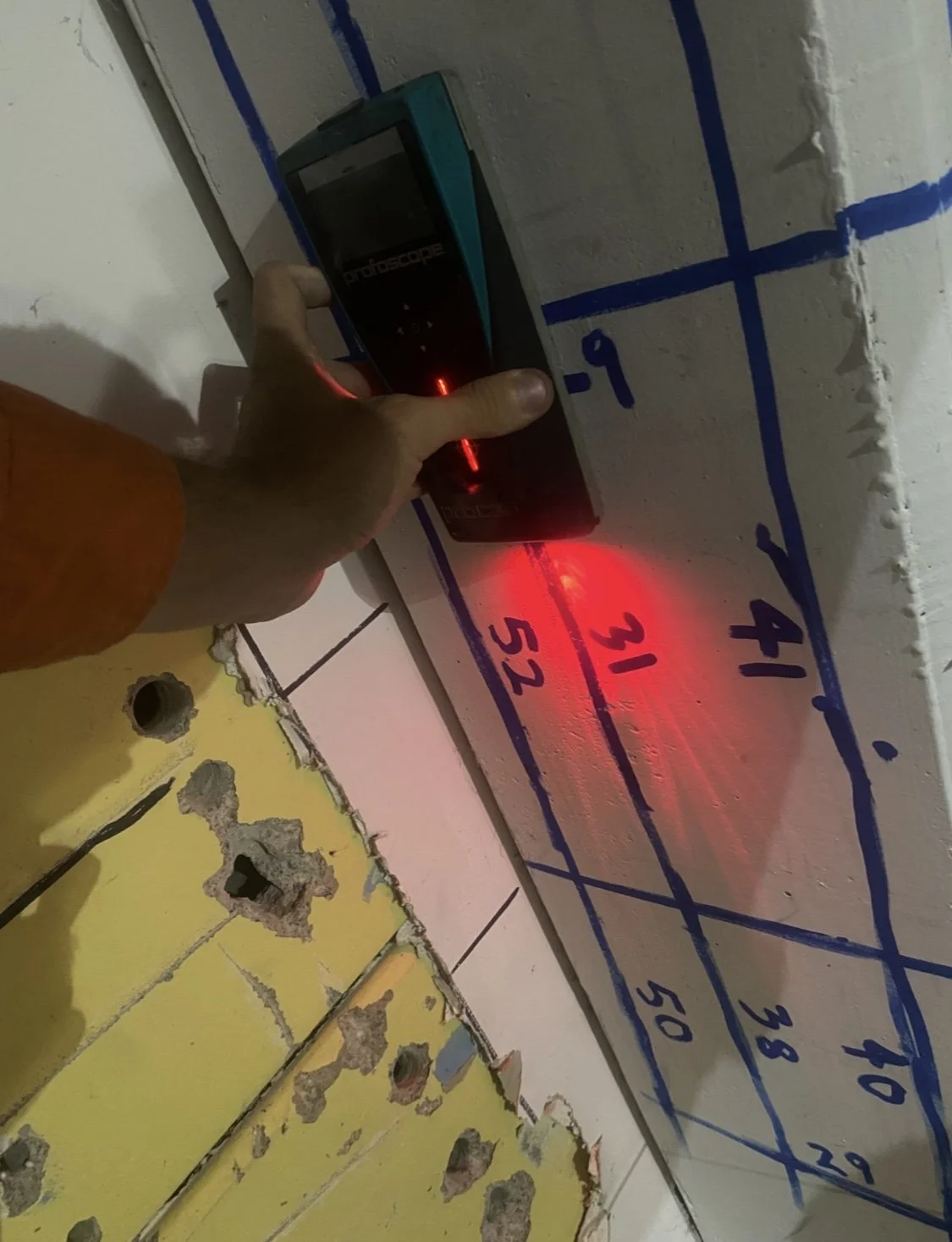 Profoscope in use on marked-up wall