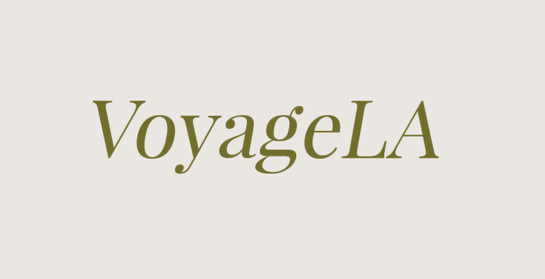VoyageLA logo with white and pink text on a black circular background.