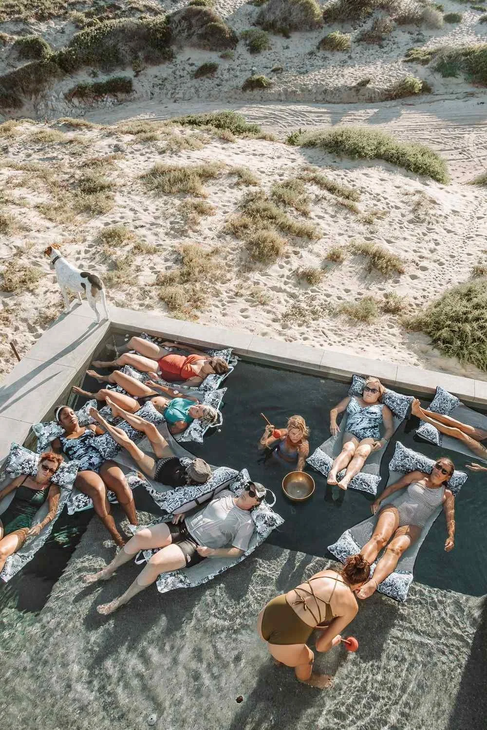 women-floating-in-pool-desert-retreat.jpeg