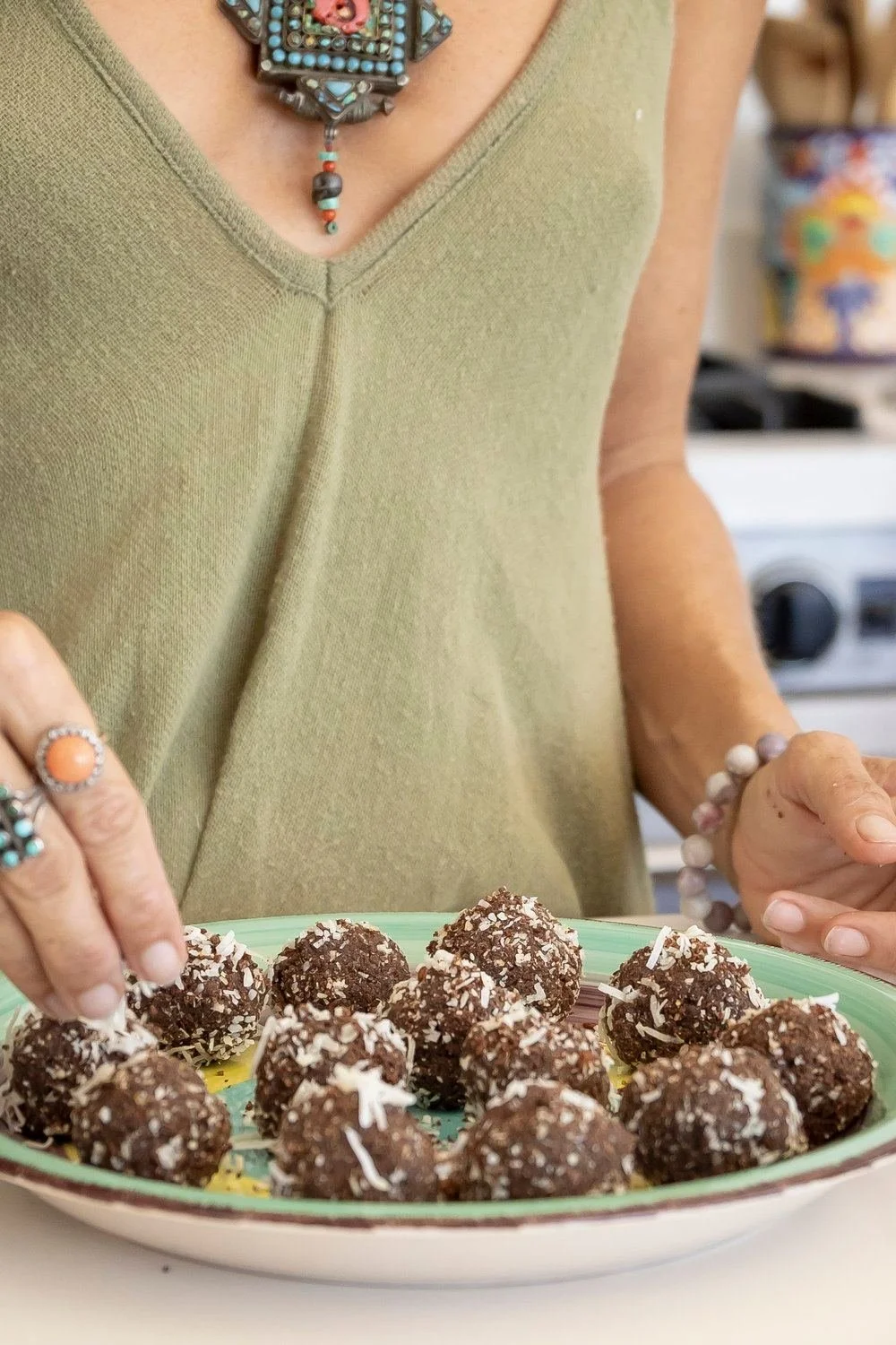 agathe-fay-sprinking-coconut-on-vegan-energy-balls.jpeg