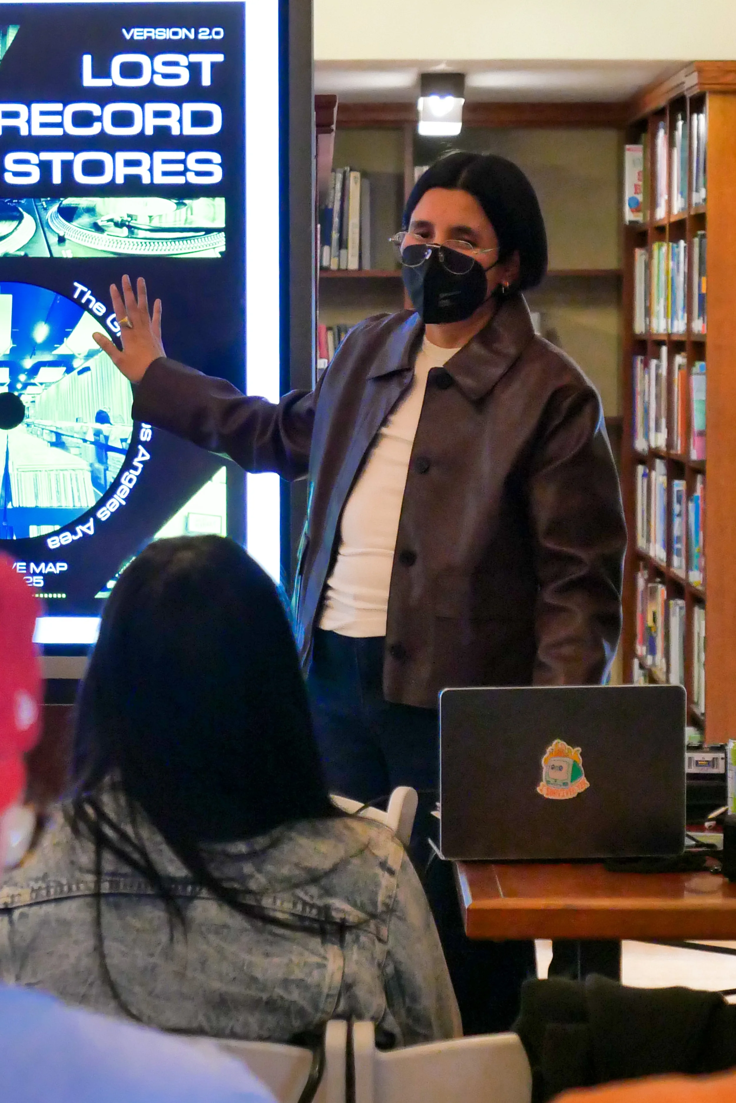 A person giving a presentation in front of the audience