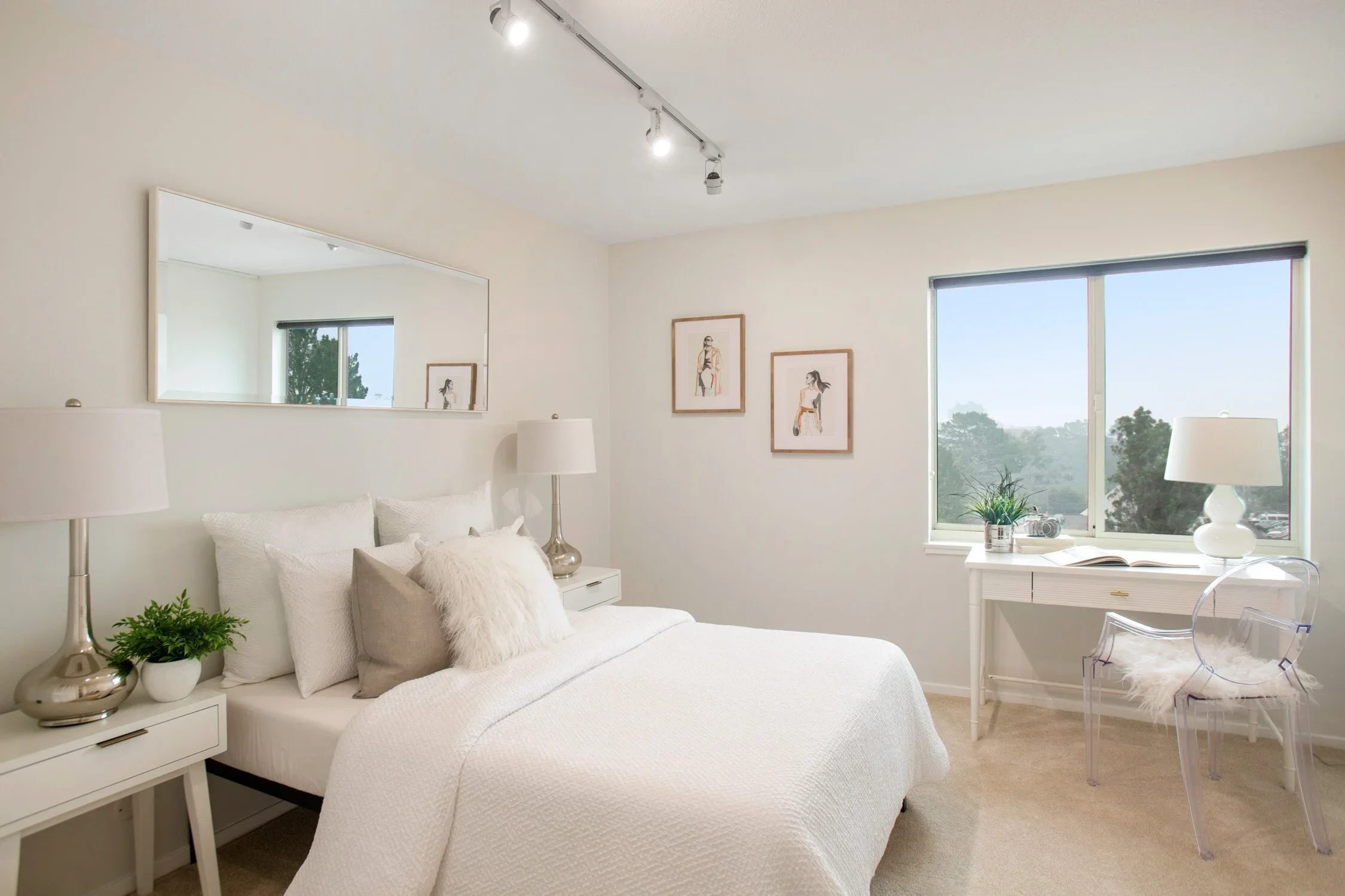 Video tour of a Beverly Hills listing, bright bedroom with a desk and window view.