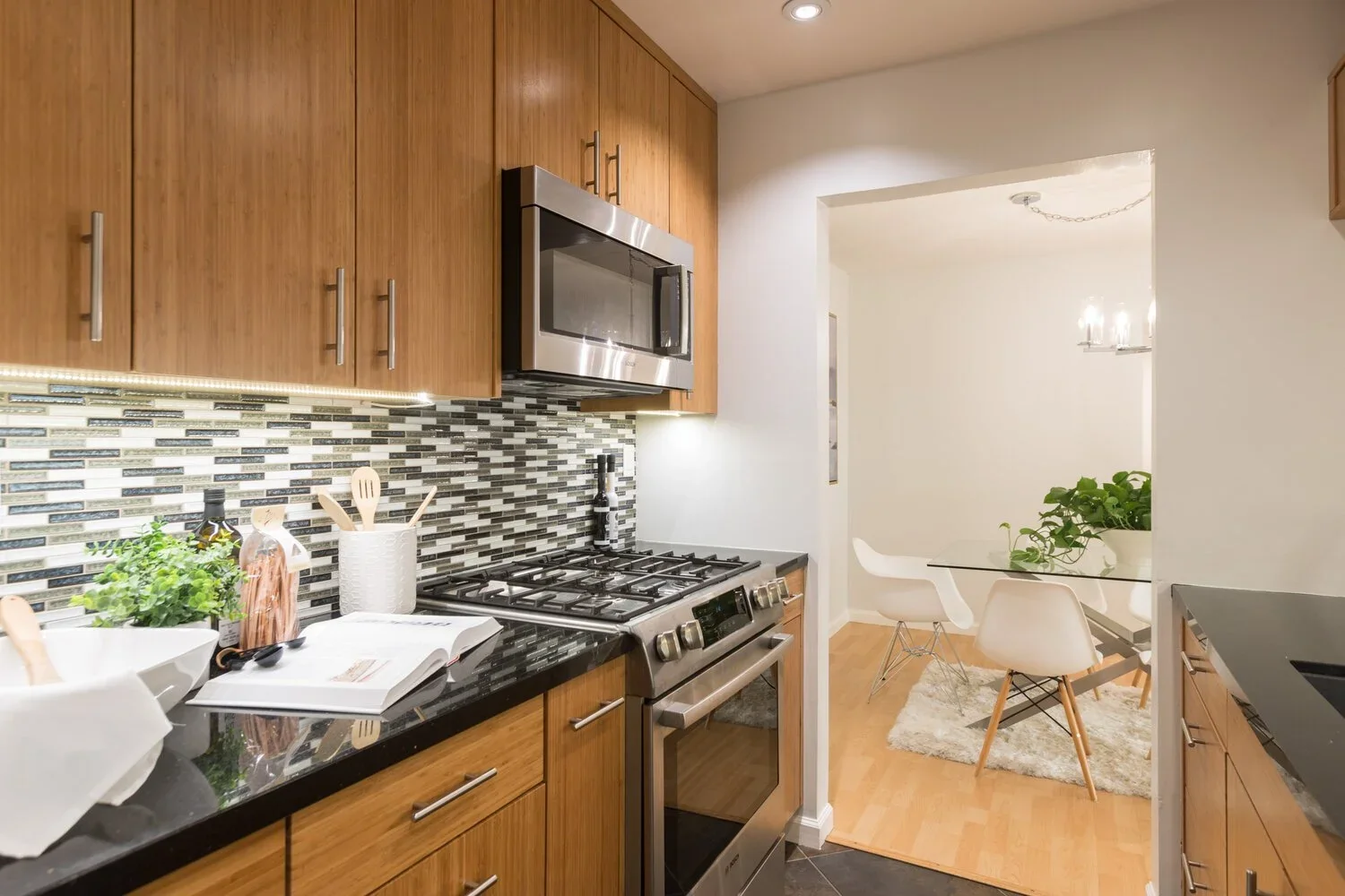 Single property website photography for Beverly Hills listings, kitchen with wood cabinets and tile backsplash.