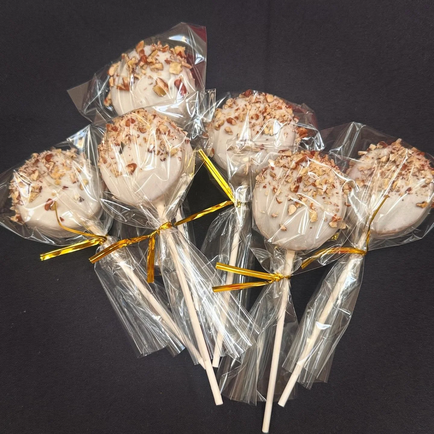Butter Pecan Cake Pop! 

Butter pecan cake, dipped in white chocolate, topped with chopped pecans.