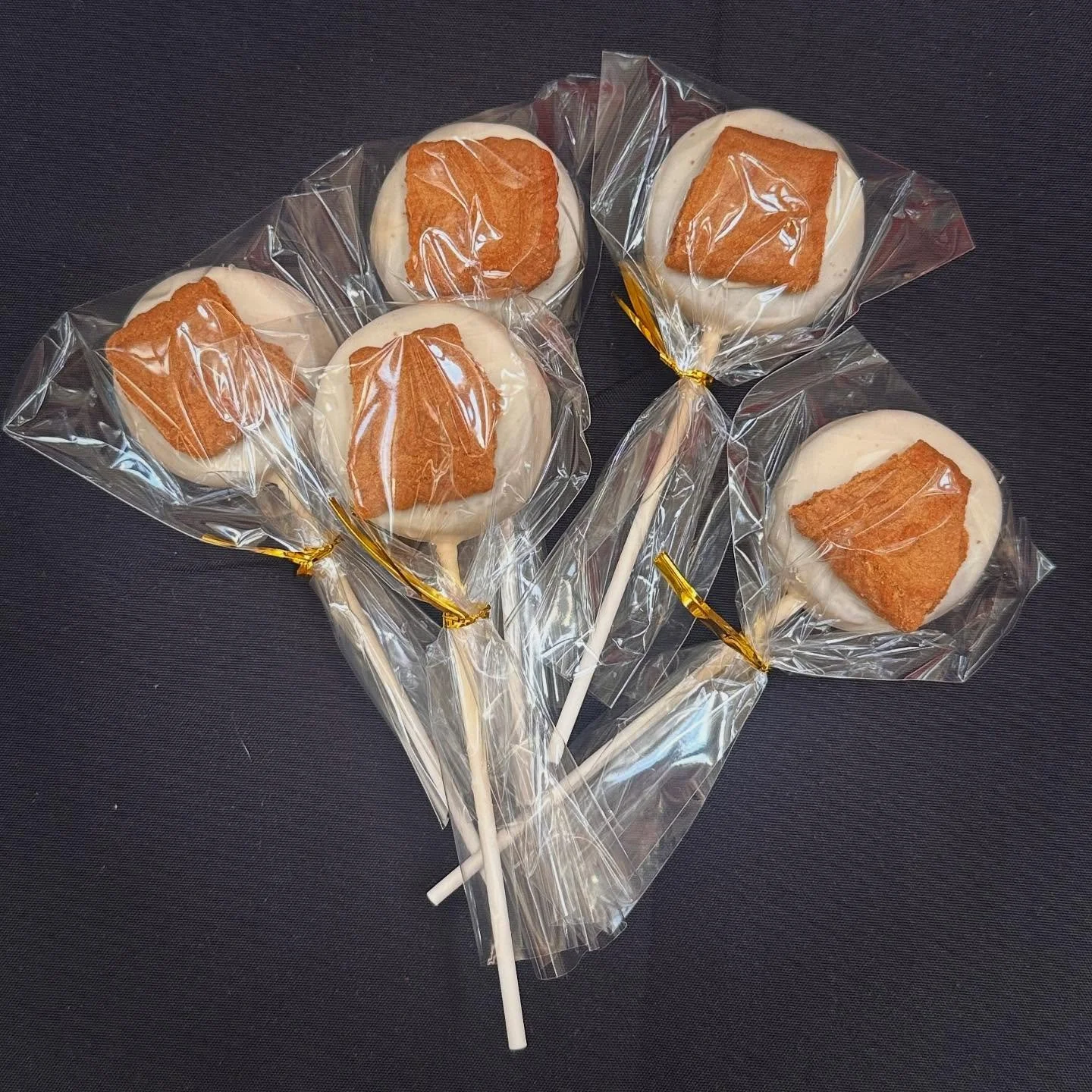 Cookie Butter Cake Pop 

Biscoff flavored cake, dipped in cookie butter infused white chocolate, topped with biscoff cookie pieces.