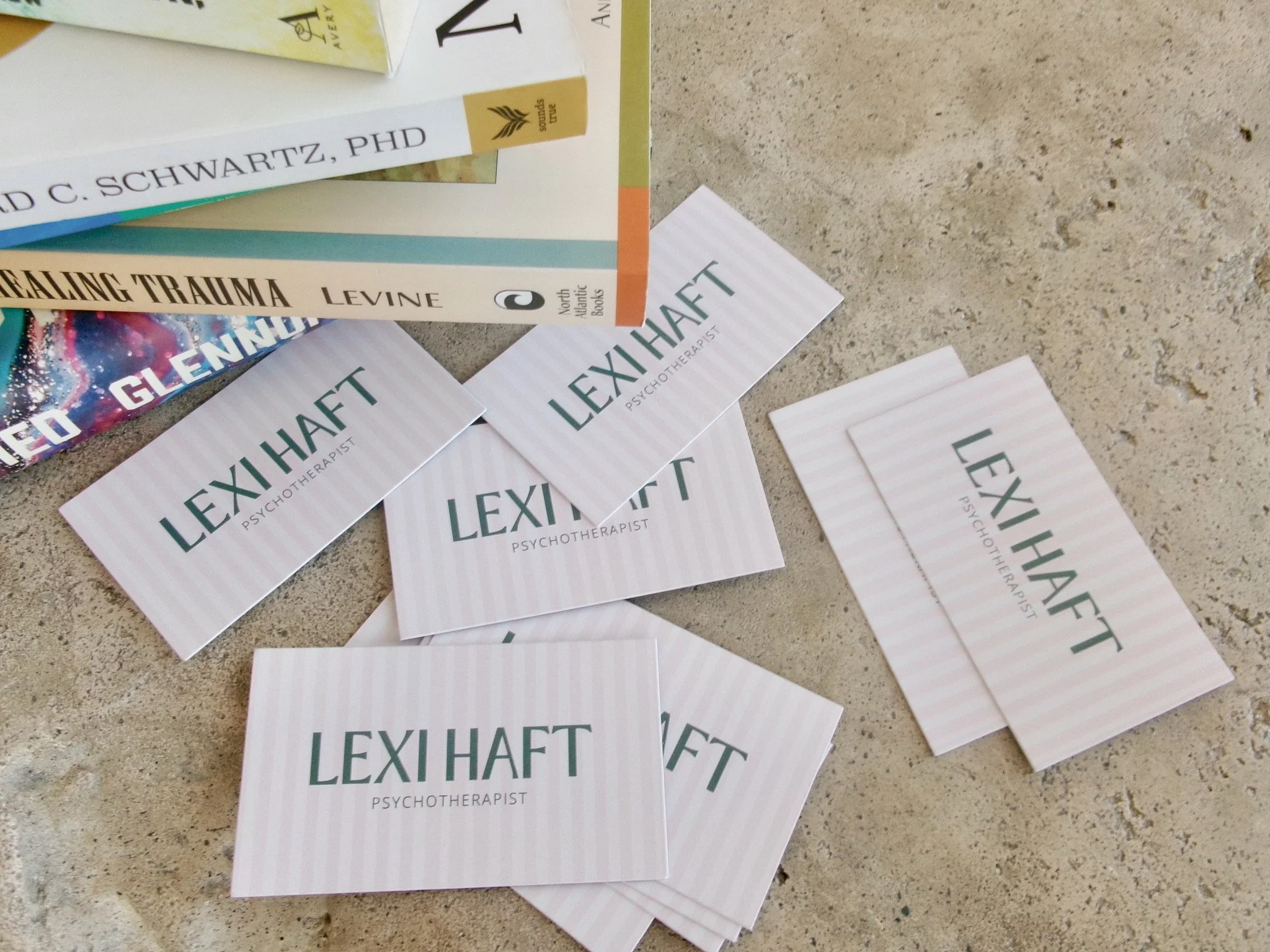 Business cards for Lexi Haft, psychotherapist and founder of Wellhouse Psychotherapy.