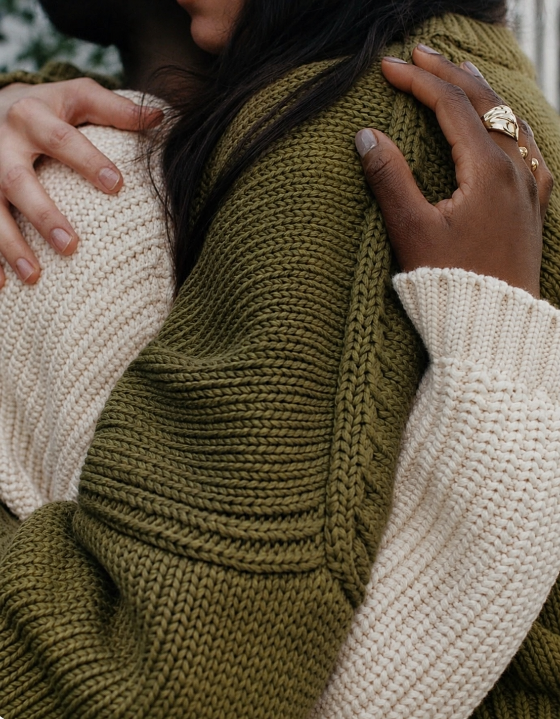 Two people hugging in a moment of emotional support.