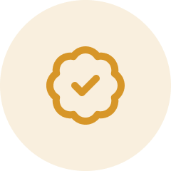 A large, round, golden-brown pancake with a small pat of butter on top.