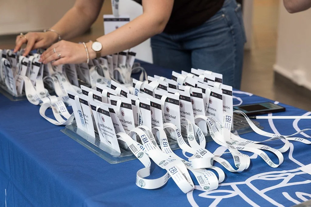 Reception desk with conference lanyards. Social Sciences Campus, 9 May 2025. Photo: Serena Gallorini / Fotoproject.
