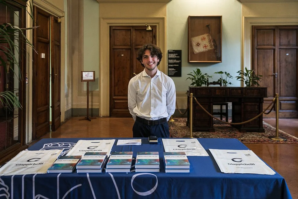 The Giappichelli publishing stand in the antechamber of the Aula Magna, displaying the Routledge volume co-edited by Filippo Zatti and Rosa Giovanna Barresi. Florence, 8 May 2025. Photo: Andrea Pecchioli / Fotoproject.