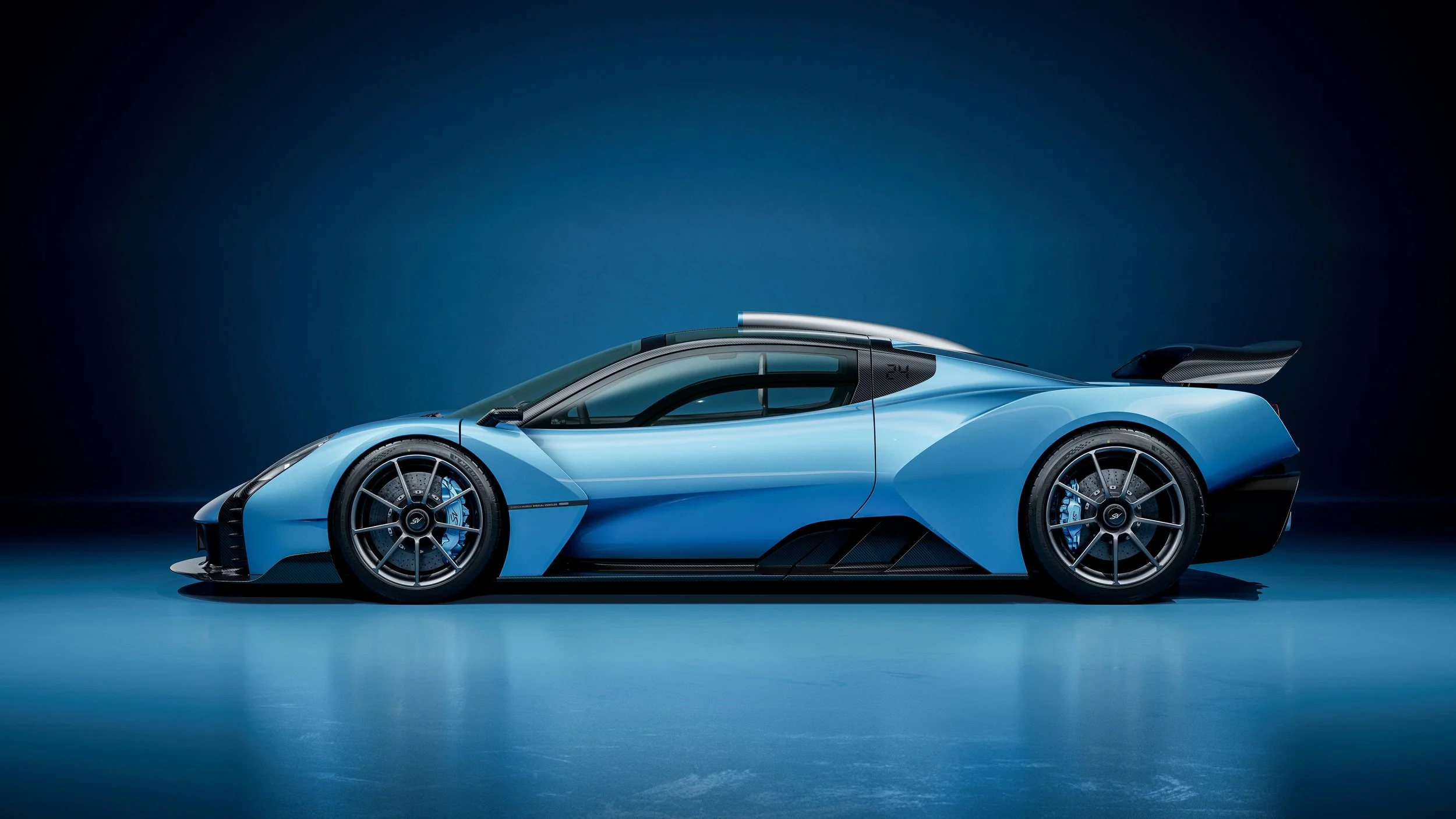 Gordon Murray Special Vehicles Le Mans GTR in light blue, side profile view with carbon wing and aerodynamic bodywork.