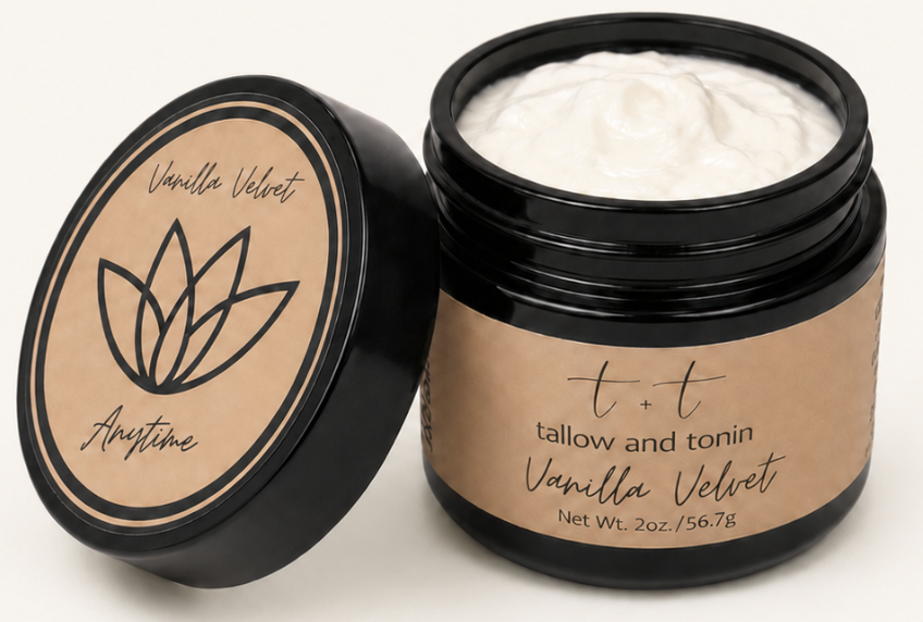 Open jar of vanilla bean scented cream with black lid beside lid with minimalist label design.