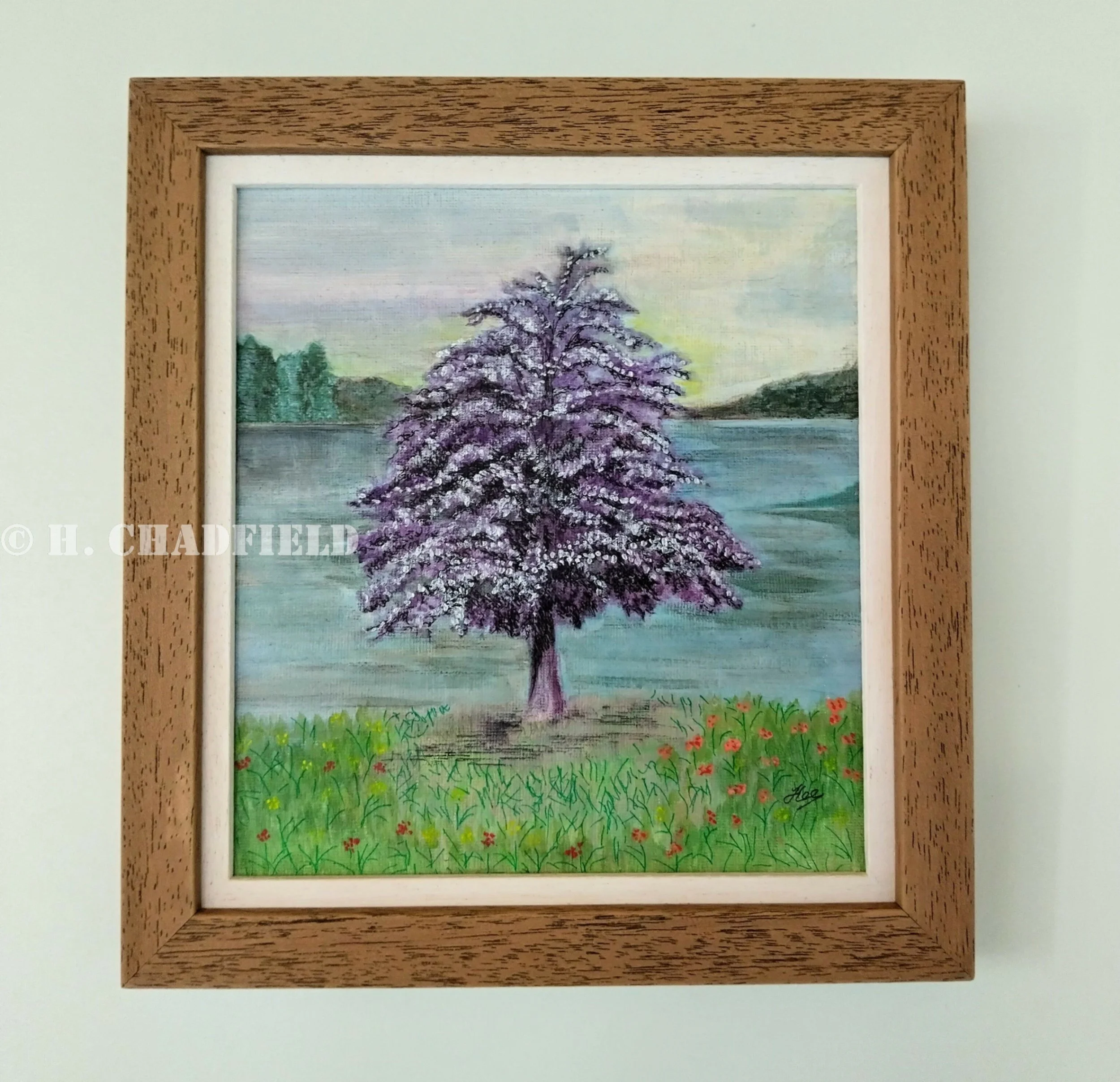 A painting of a purple and silver tree in front of a lake or loch