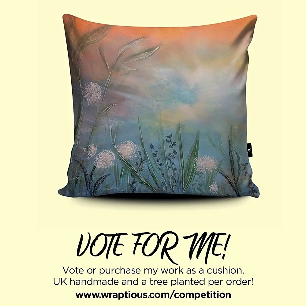 A cushion featuring a design showing colourful clouds and sky with dandelion clocks and foliage in the foreground