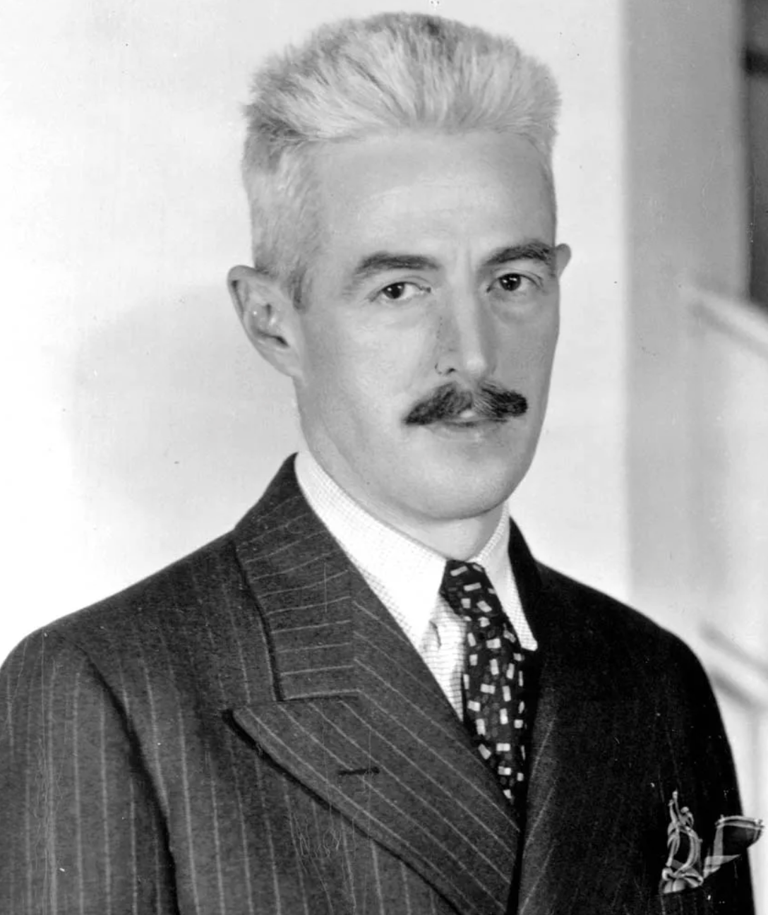 A black and white photo of author Dashiell Hammett