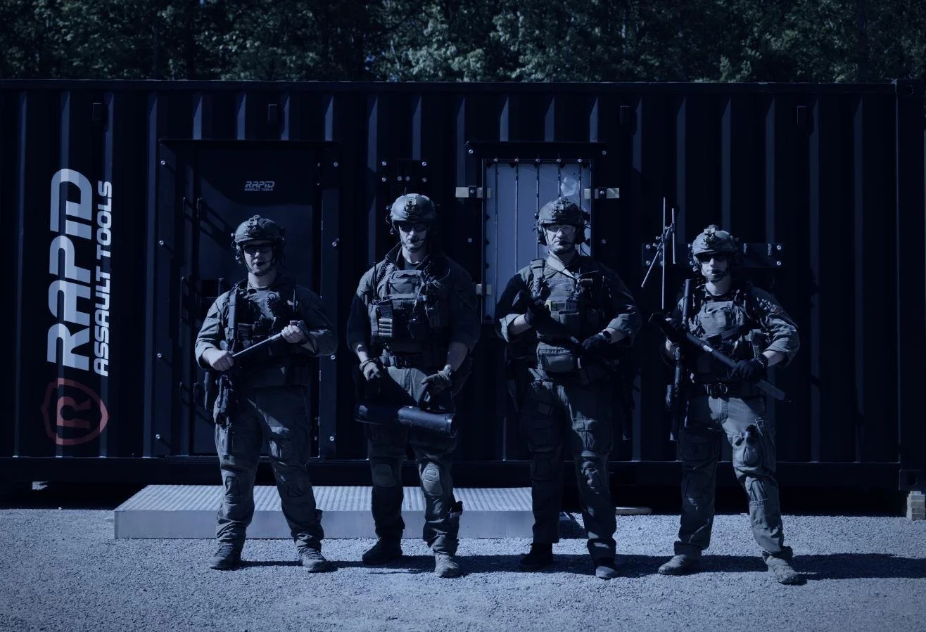 Rapid Assault Tools shoot by CXIX: four soldiers in tactical gear standing in front of a black shipping container labeled 'RAPP Assault Tools'.