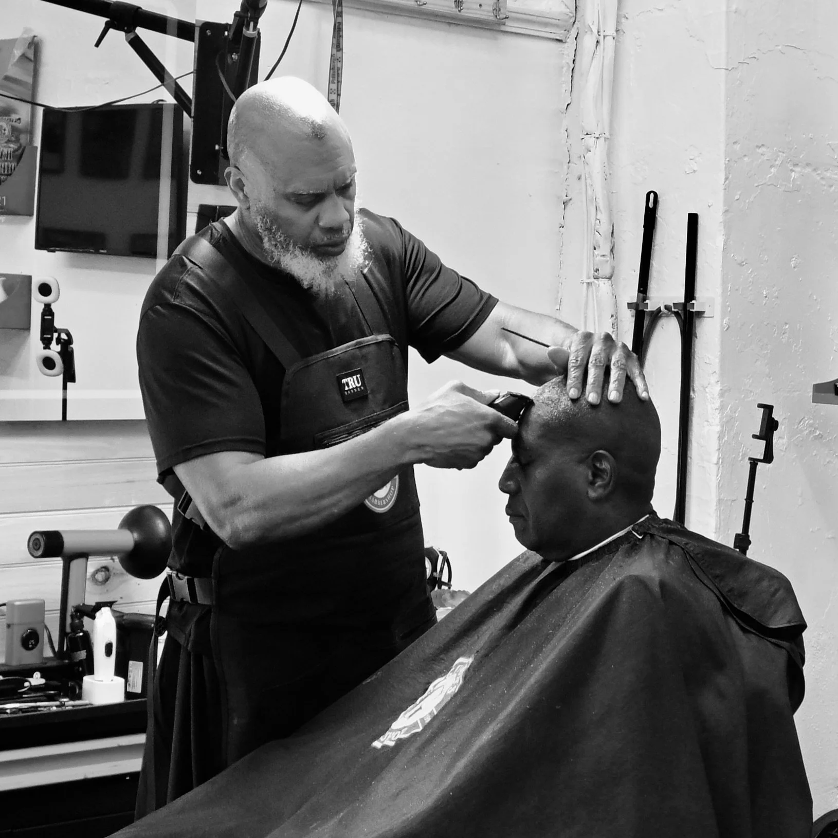 Mr. Sharp at work in Gordon's Barbershop