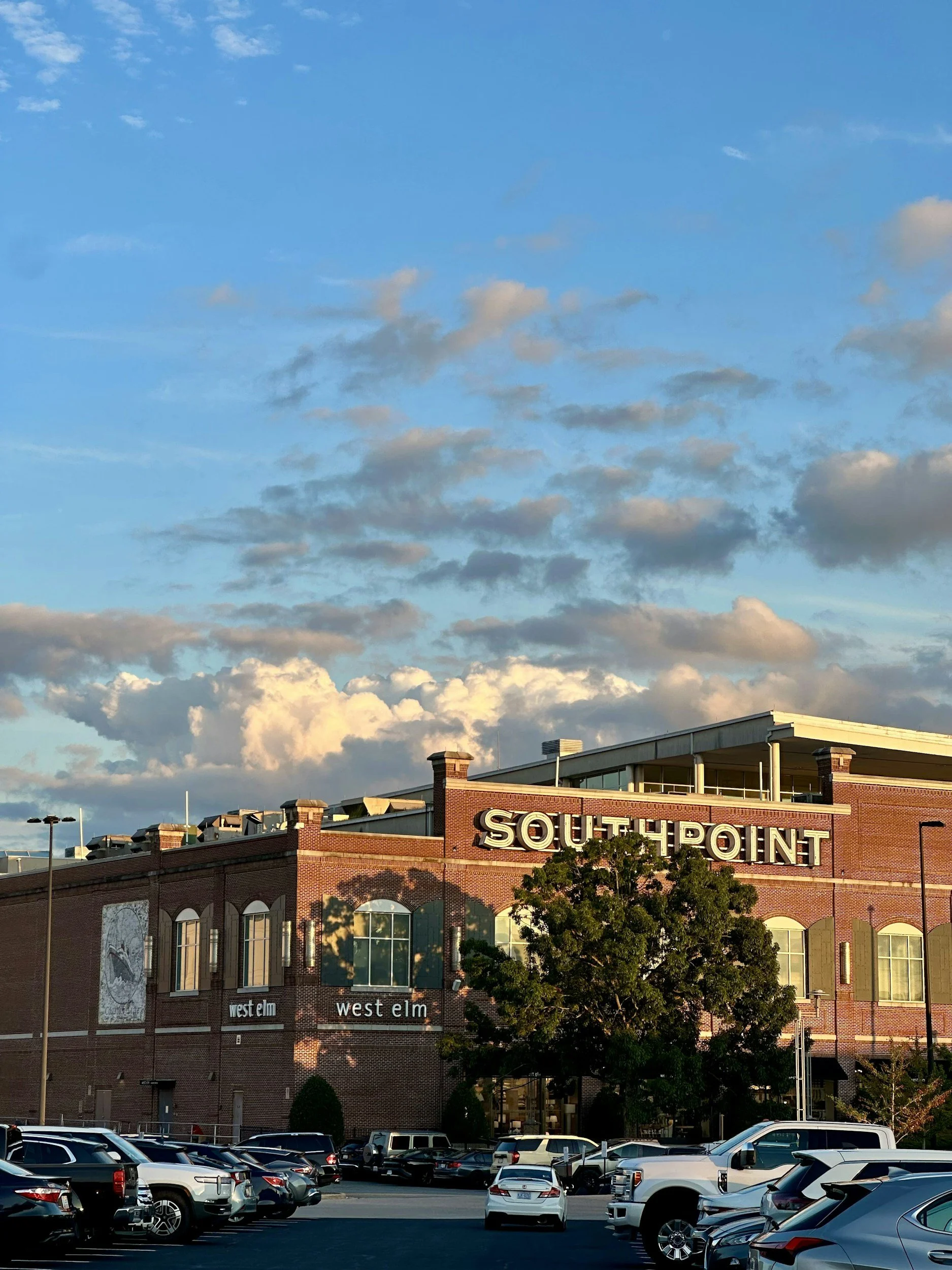 Southpoint retail center storefront with parking lot, representing neighborhood strip center real estate