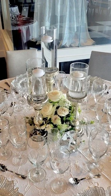 Ball cluster with tall stands and floating candles