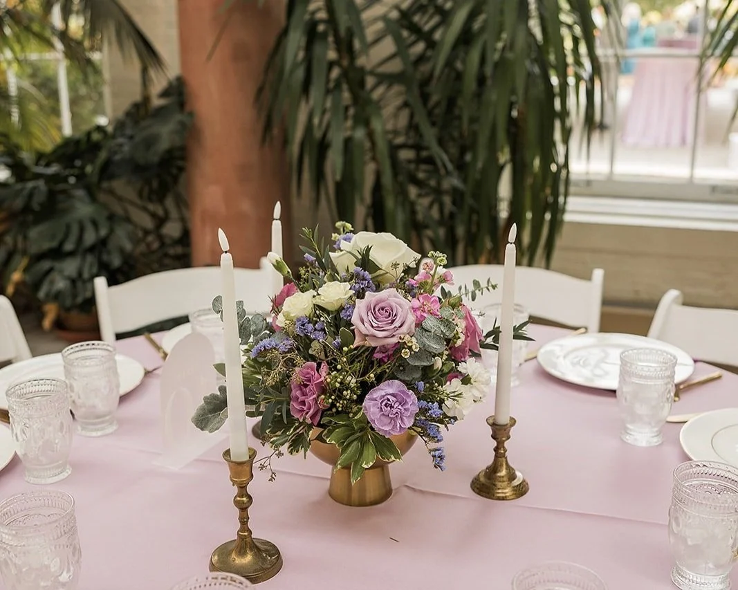 Elegant table setting with floral centerpiece and candles