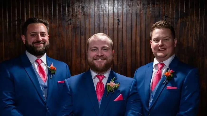 Groomsmen bouts with bright colors from the brides bouquet collection.