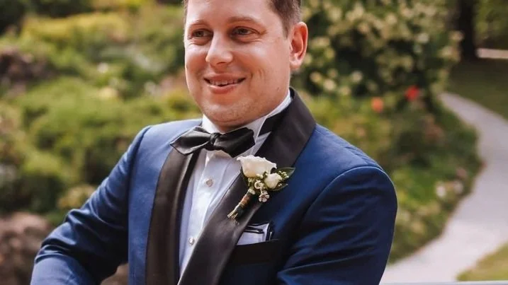 Double spray rose accented with waxflower.