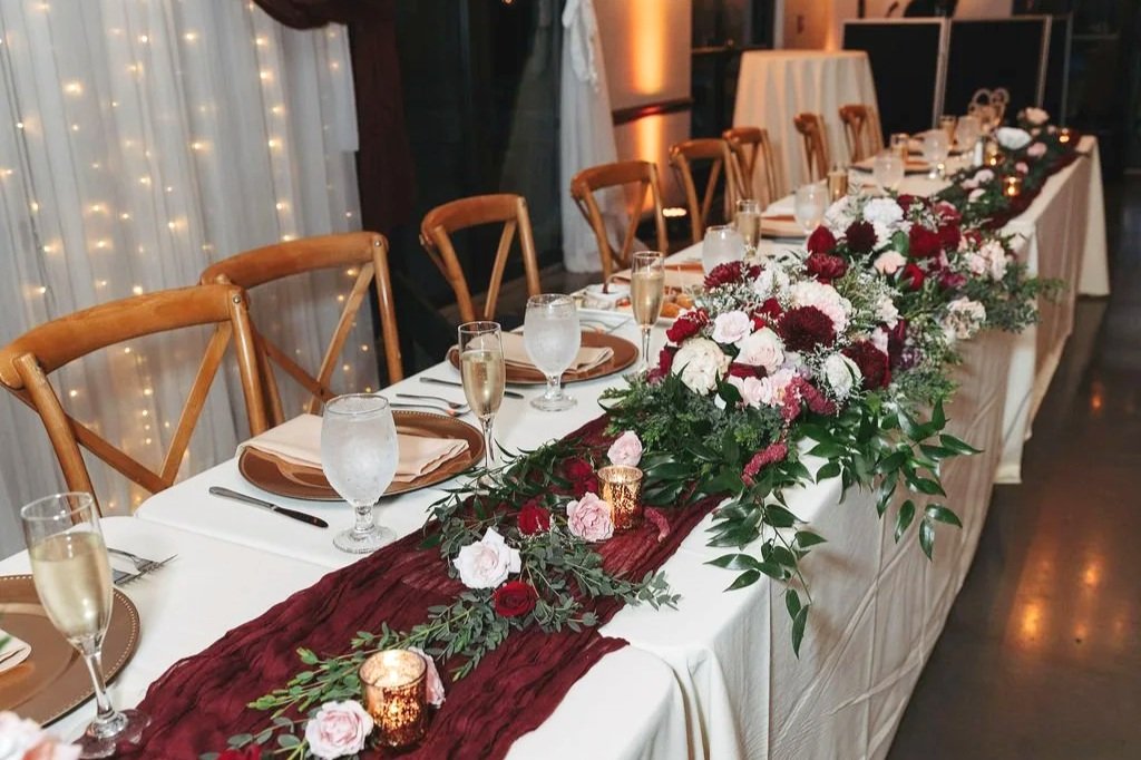 Repurposed arbor arrangements to head table