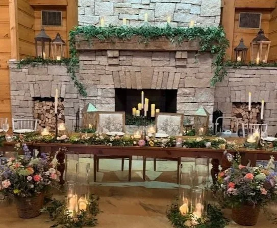 Head table runner and repurposed altar arrangements to floor arrangements