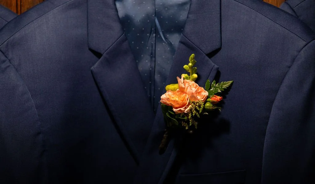 Bold double spray rose and button bout.