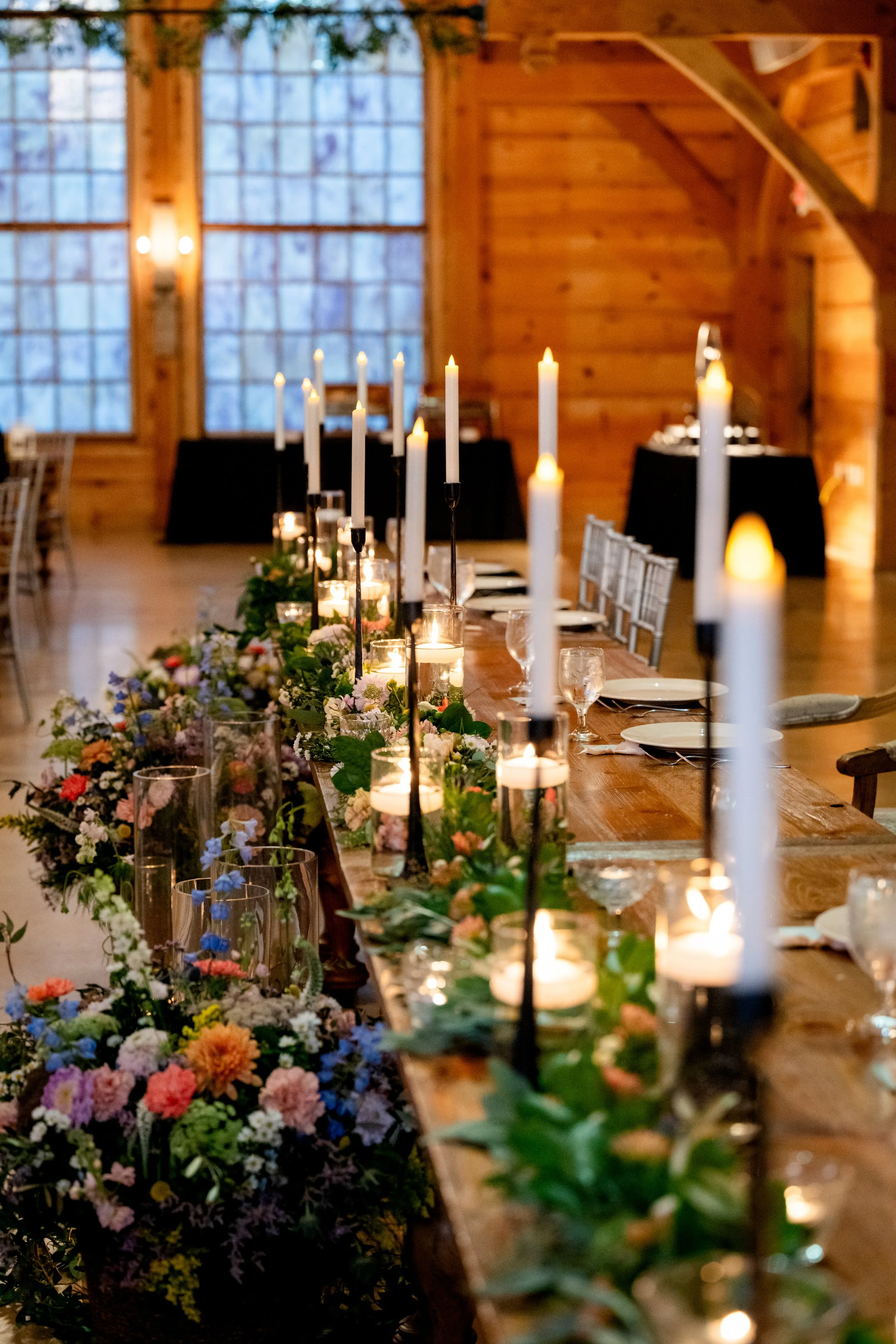 Head table with garland runner & Blooms and floor arrangements.
