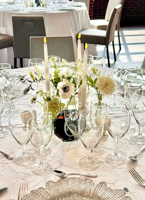 White flower bud vases and taper candles