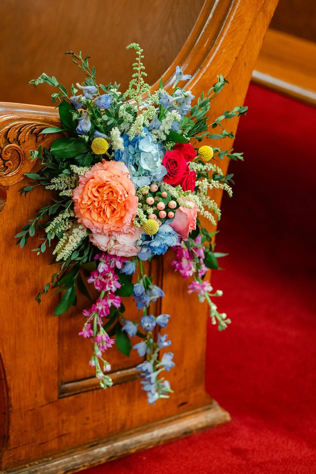 Colorful Aisle markers on church pews.