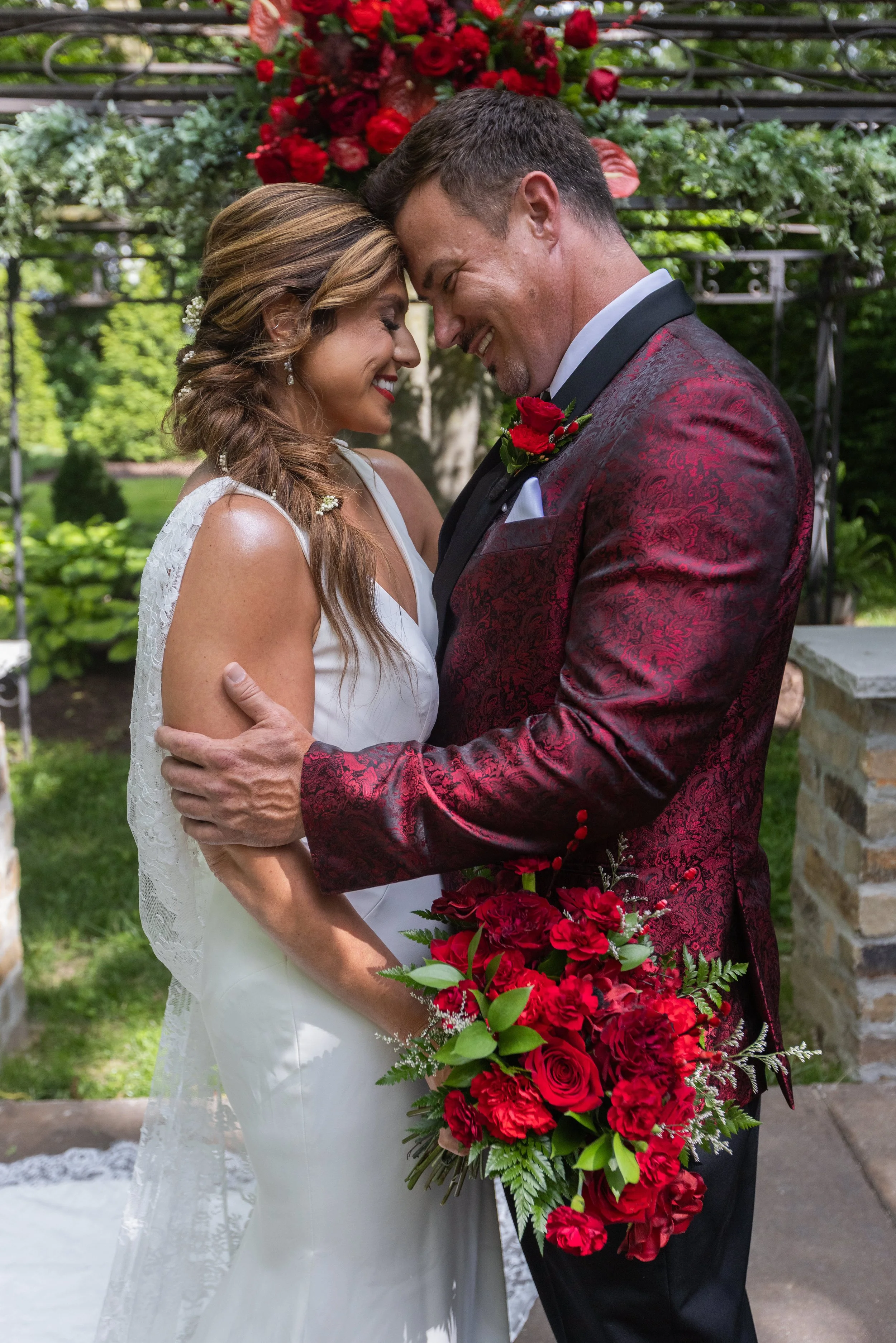 Bride and Groom red bouquet and bout