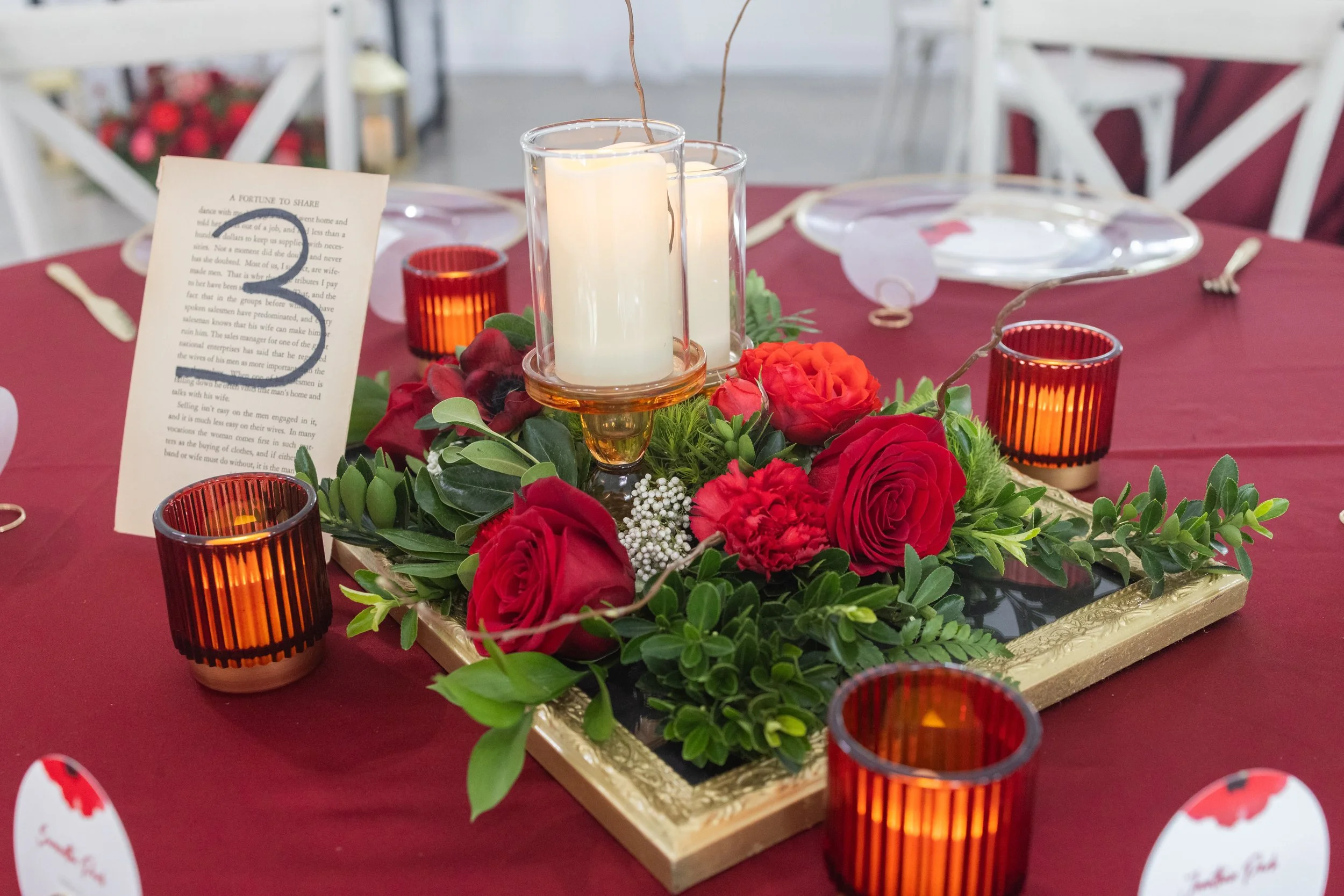 Scattered greenery and blooms in red