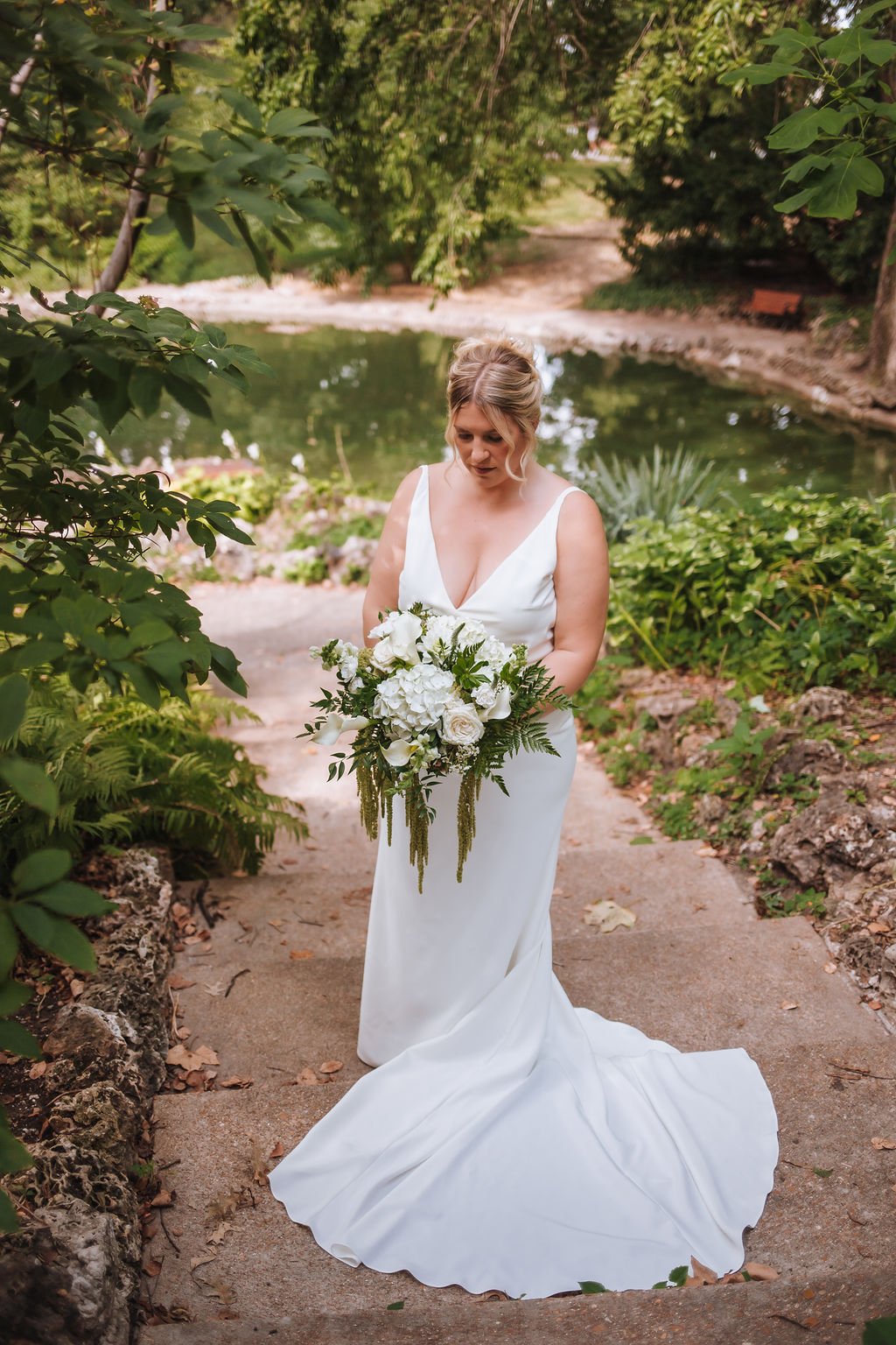 Bride holding her art deco inspired cascading bouquet.